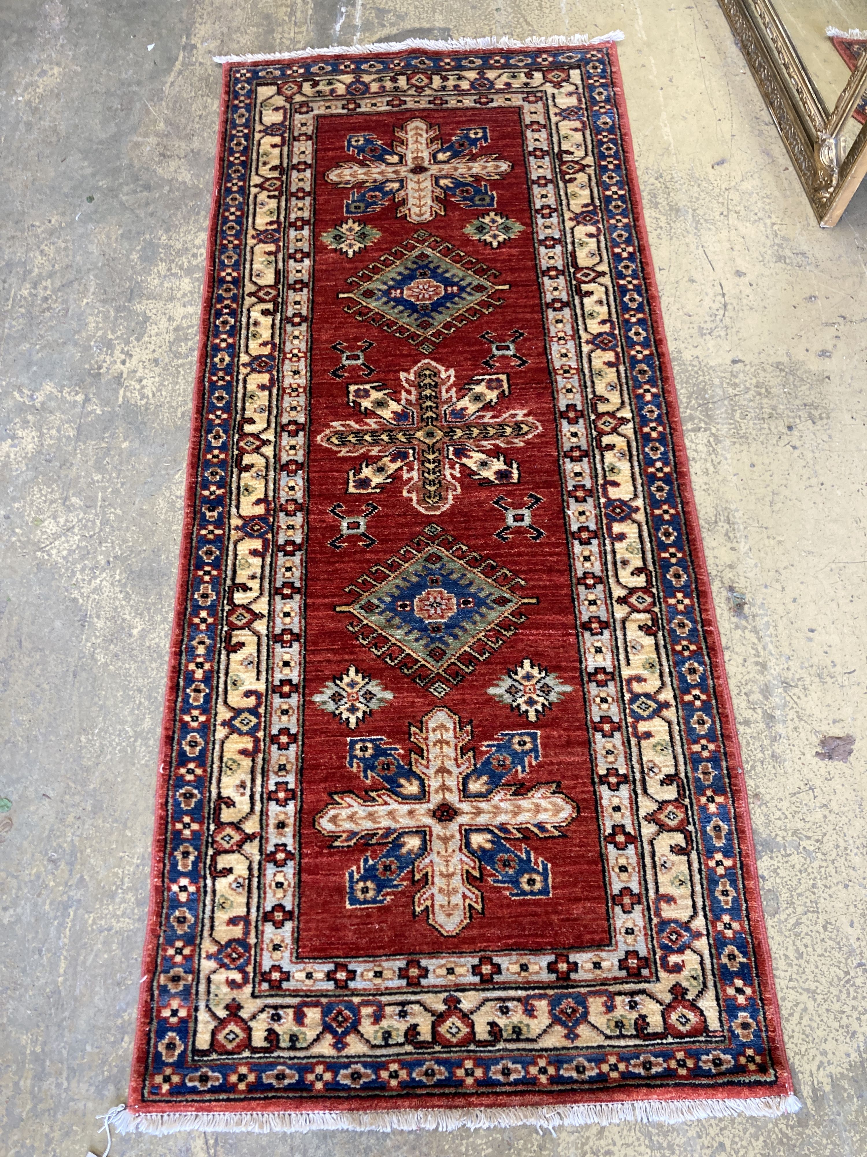 A Kazak style red ground runner, 200 x 84cm